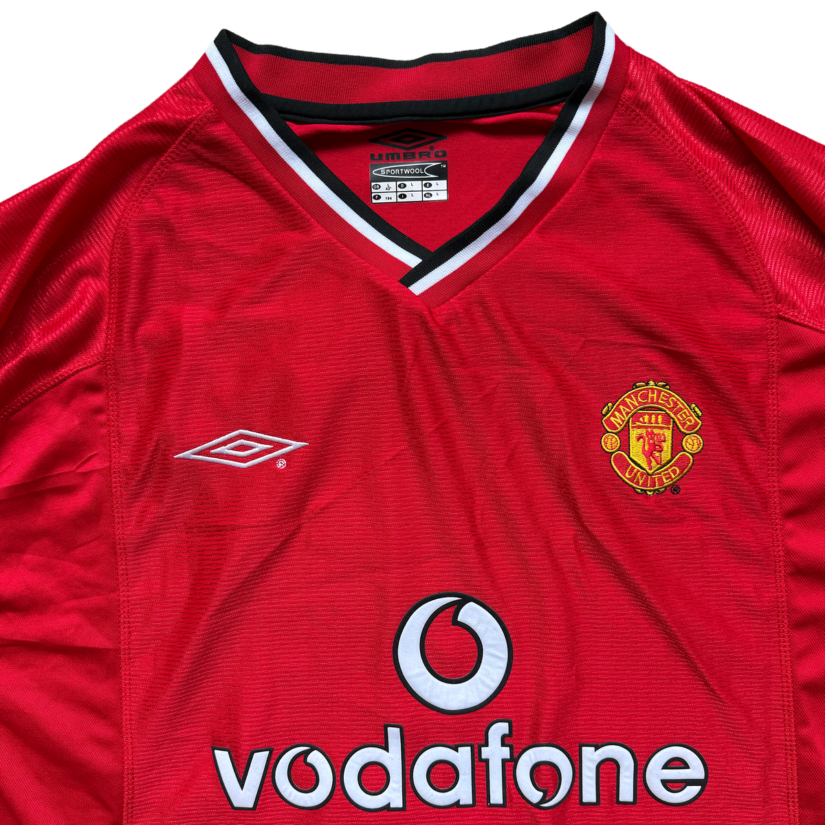 Manchester United home shirt collar, crest and Umbro Sportwool label